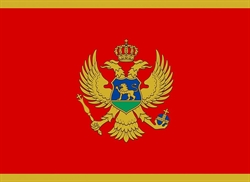 [ai] The flag of Montenegro featuring a red background with a gold border. In the center, a double-headed eagle is depicted in gold with a blue shield on its chest, displaying a lion, surrounded by a crown.